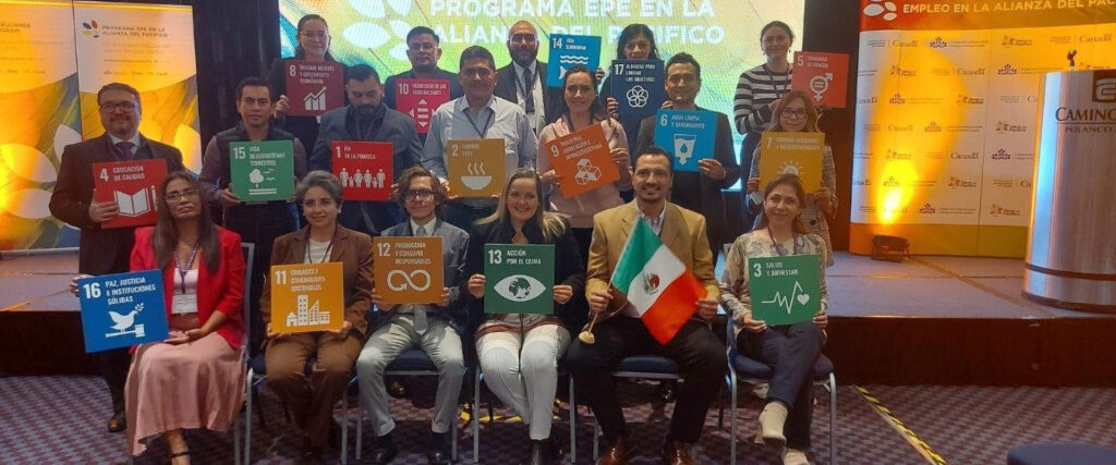 Members of the Pacific Alliance post with UN SDG posters