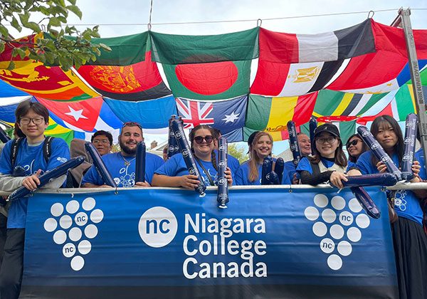 custom-english-1 A group of English language students on a NC Wine Parade float
