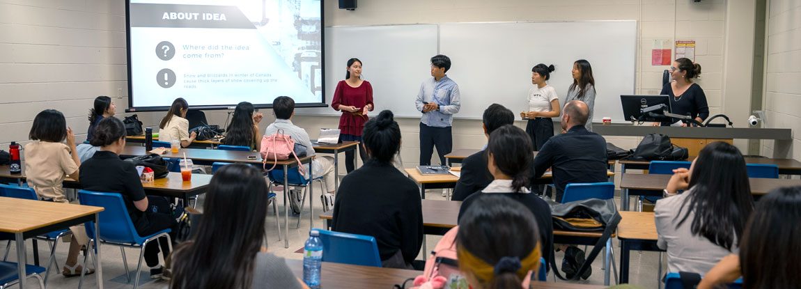 custom-english-main Students in a customized English class listen intently in class