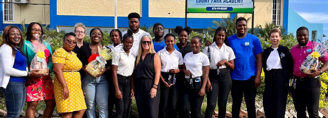 sust-aos-main SAGE participants pose for a group photo outside in Jamaica